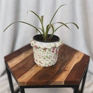 Handmade crocheted pink floral 3 inch nursery pot cover. PLANT NOT INCLUDED